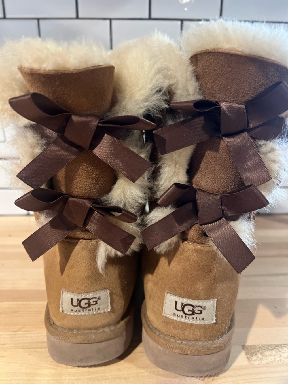 UGG Chestnut Suede Boots with Cream Shearling and Dark Brown Bows